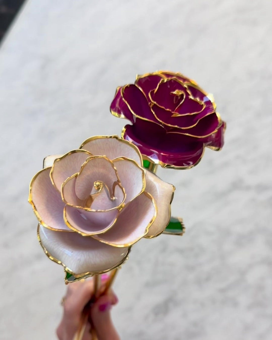 Two gold roses held together