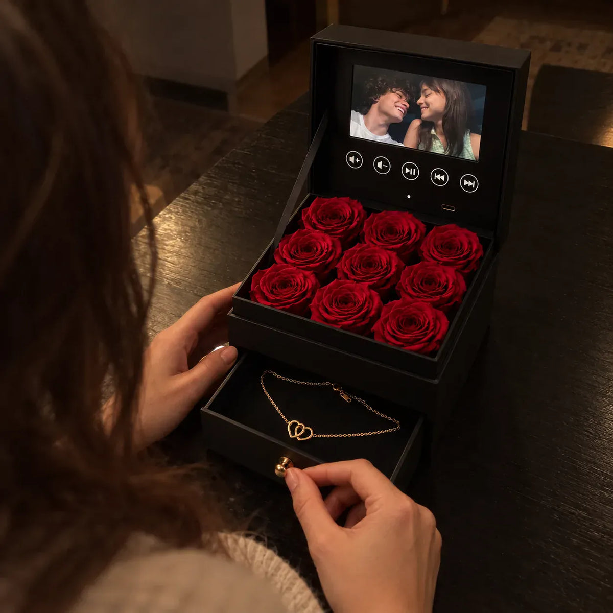 She slides open the drawer under her roses and finds her engraved Linked Hearts necklace