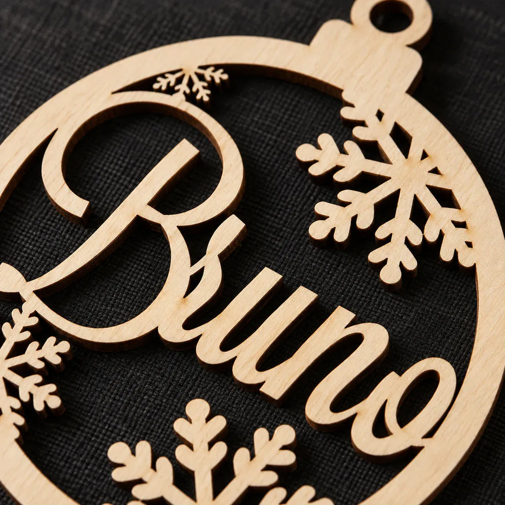 Close detail of solid wooden letters and snowflake cutwork